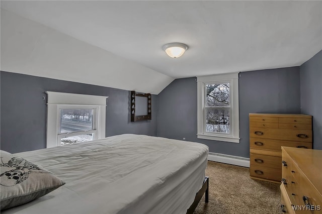 bedroom with a baseboard radiator, baseboards, lofted ceiling, and carpet