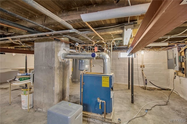 utility room featuring water heater and electric panel