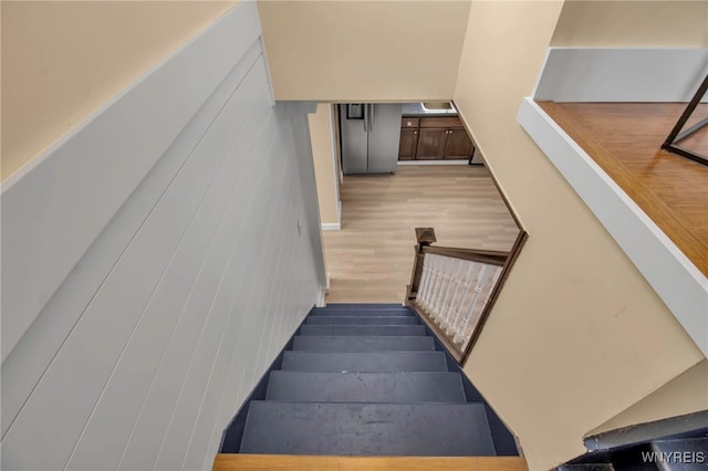 stairway with wood finished floors