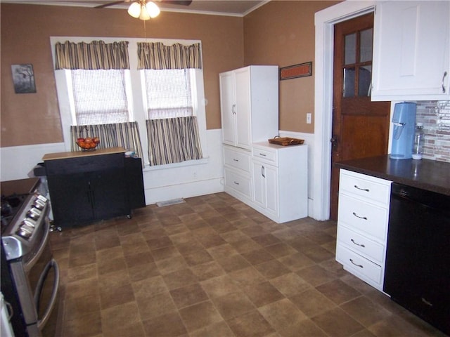 kitchen with stainless steel range with gas cooktop, dark countertops, a ceiling fan, white cabinets, and dishwasher