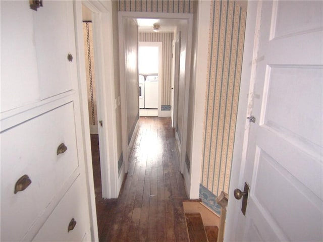 hallway featuring washer and clothes dryer and hardwood / wood-style floors