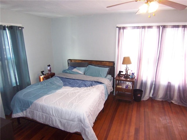 bedroom with a ceiling fan and hardwood / wood-style floors