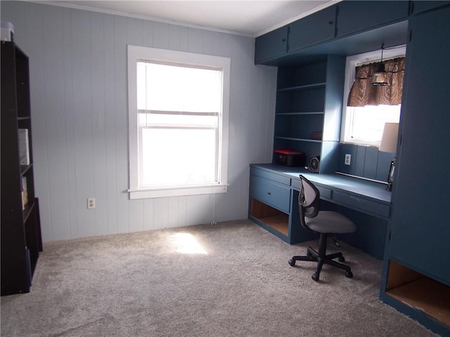 carpeted office featuring crown molding