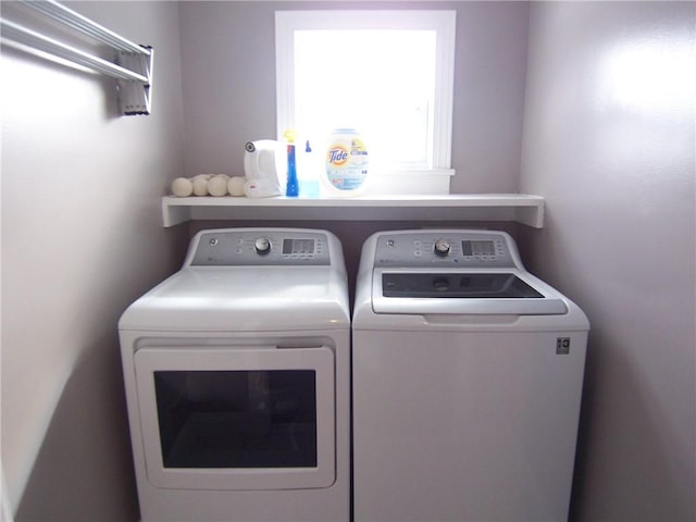 laundry room featuring laundry area and separate washer and dryer