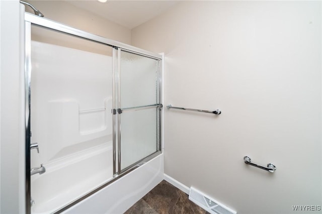 full bath featuring baseboards, visible vents, and bath / shower combo with glass door