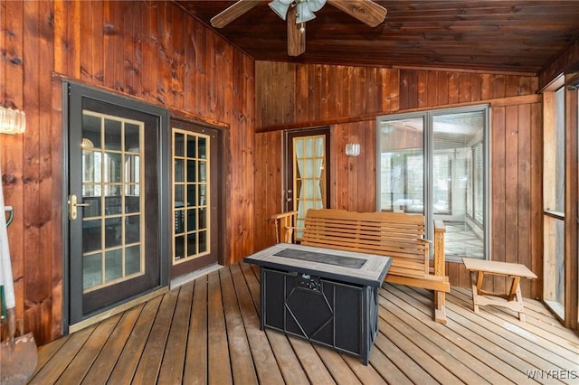 sunroom with a ceiling fan, lofted ceiling, wood ceiling, and a sauna