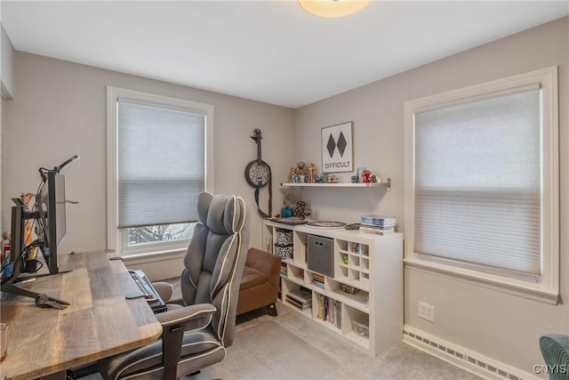 carpeted office space with a baseboard radiator