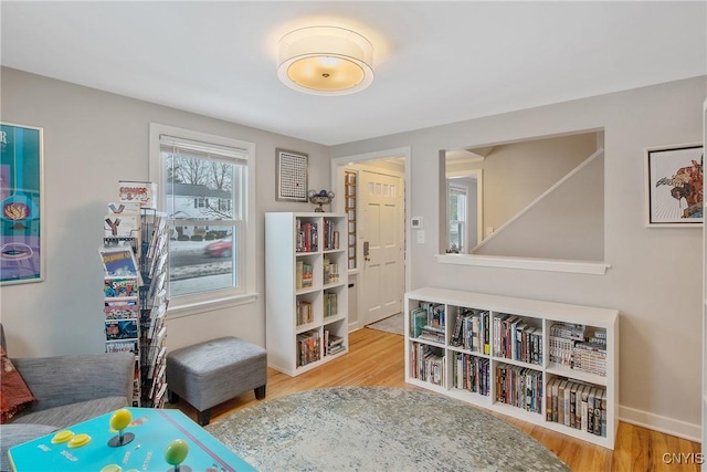 bedroom with baseboards and wood finished floors