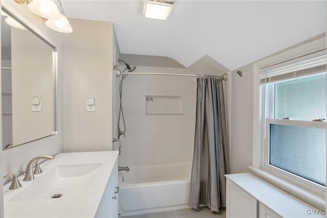 full bath with shower / tub combo with curtain, vanity, and tile patterned floors