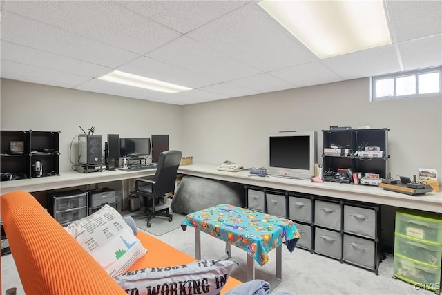 carpeted office featuring a paneled ceiling