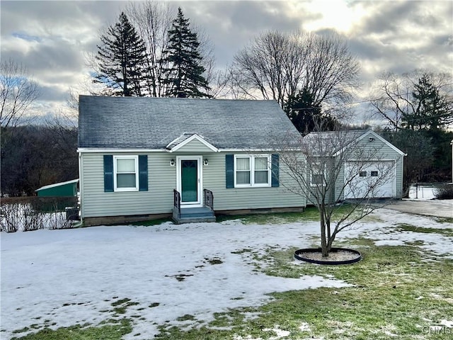 view of front of property with a garage, driveway, and a shingled roof