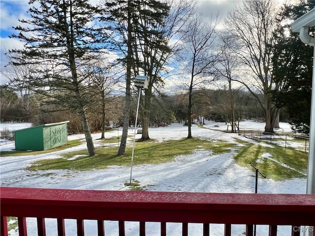 snowy yard with an outdoor structure