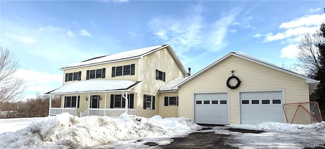 view of front of house featuring a garage and covered porch