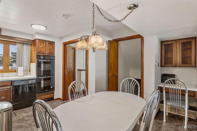 dining space featuring baseboards