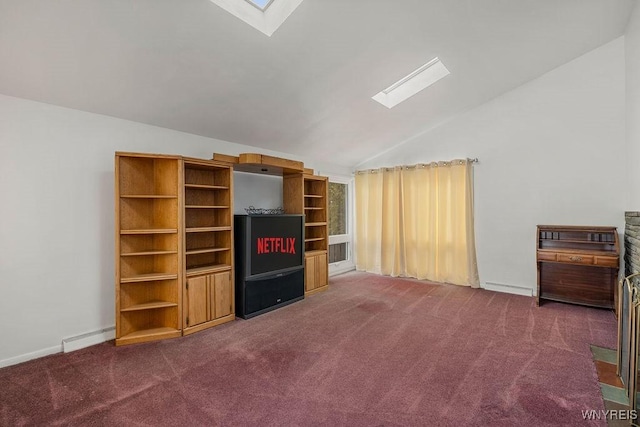 unfurnished living room with lofted ceiling with skylight, dark carpet, and baseboard heating