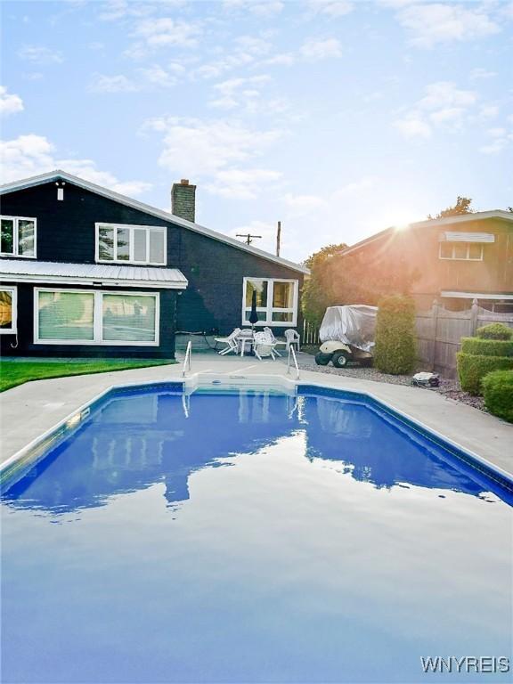 view of swimming pool with a fenced in pool, a patio area, and fence