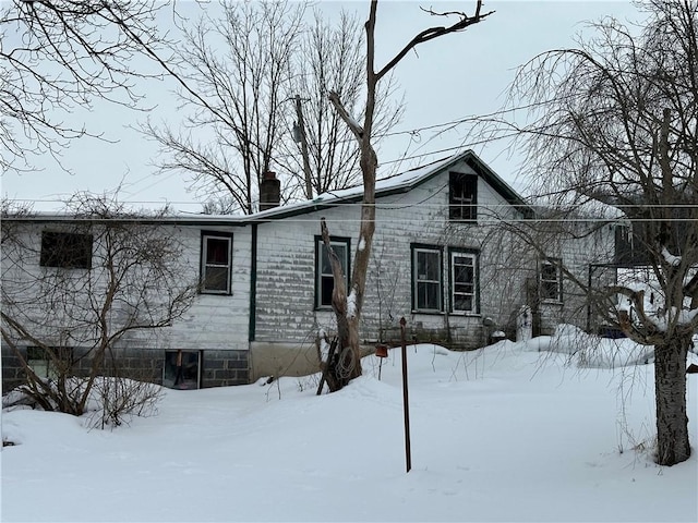 view of front of home featuring a chimney