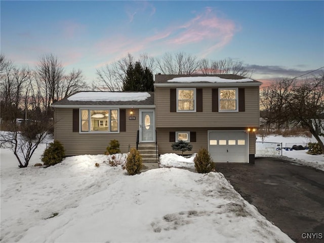 split level home featuring a garage