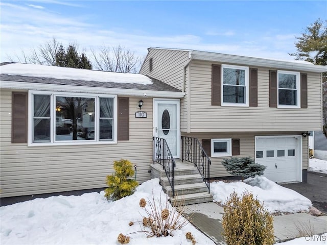 split level home featuring an attached garage