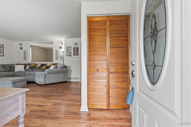 entrance foyer with visible vents and light wood-style floors