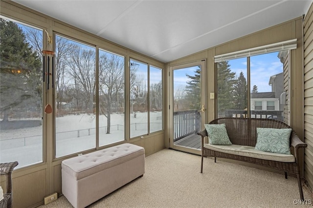 sunroom / solarium with vaulted ceiling