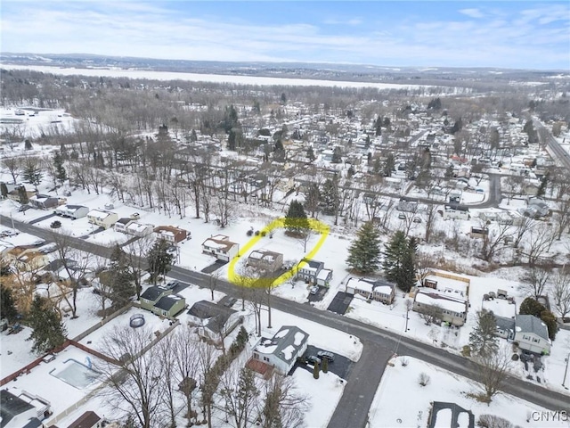 snowy aerial view featuring a residential view