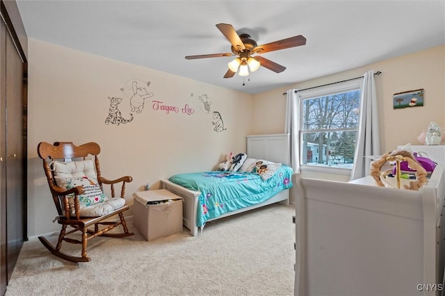 carpeted bedroom featuring a ceiling fan