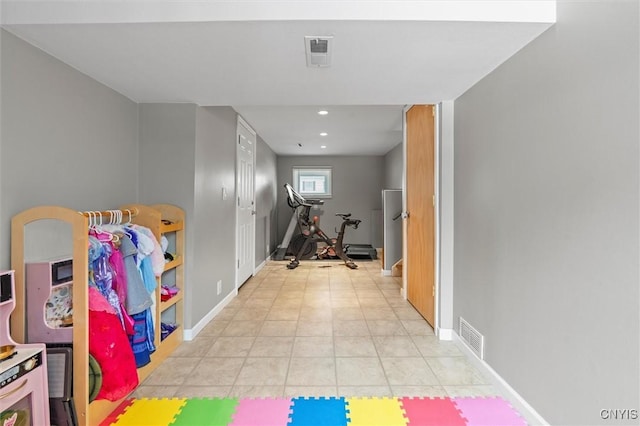 workout area with recessed lighting, visible vents, baseboards, and light tile patterned floors