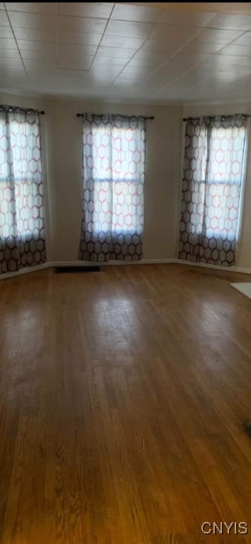 unfurnished room featuring wood finished floors