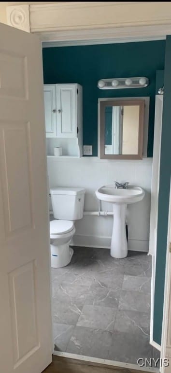 bathroom featuring toilet