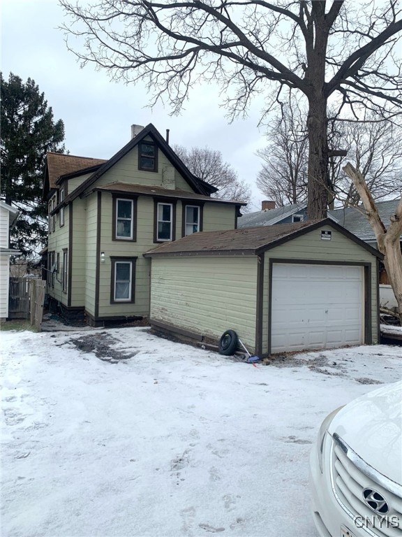 exterior space featuring a detached garage