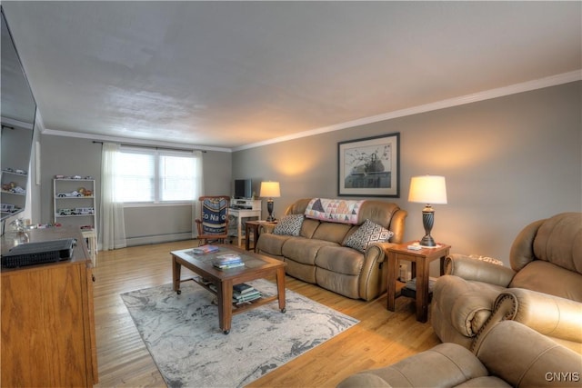 living area featuring ornamental molding, a baseboard radiator, and light wood-style flooring