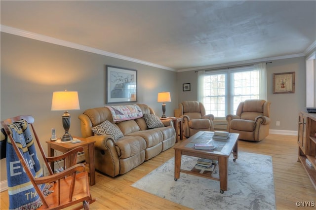 living area with light wood-type flooring, crown molding, and baseboards