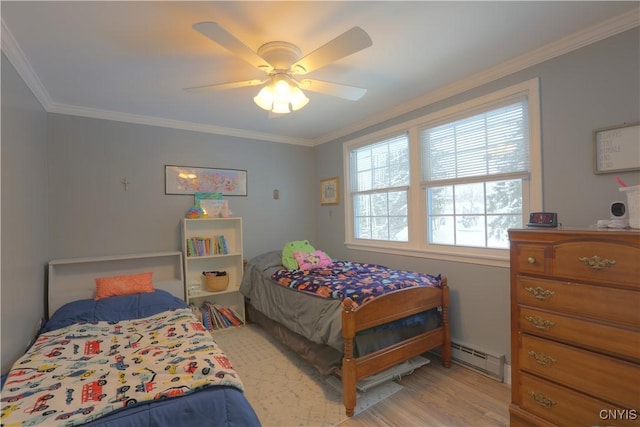 bedroom featuring a baseboard heating unit, ceiling fan, ornamental molding, and light wood-style flooring