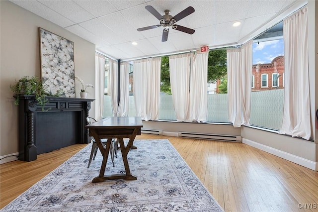 79-81 Main St, Sidney, NY 13838 - sitting room featuring a baseboard radiator, hardwood / wood-style flooring, and baseboards