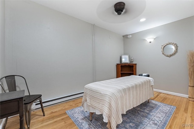 79-81 Main St, Sidney, NY 13838 - bedroom with baseboard heating, light wood-type flooring, and baseboards