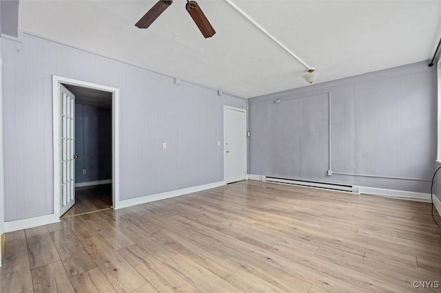 79-81 Main St, Sidney, NY 13838 - unfurnished room featuring a baseboard radiator, wood finished floors, a ceiling fan, and baseboards