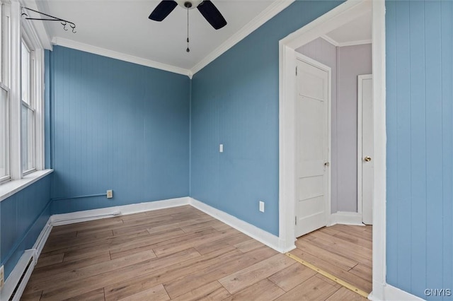 79-81 Main St, Sidney, NY 13838 - empty room featuring a baseboard heating unit, ornamental molding, hardwood / wood-style floors, and ceiling fan