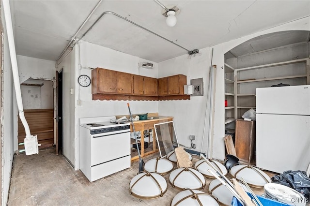 79-81 Main St, Sidney, NY 13838 - kitchen with white appliances and brown cabinetry