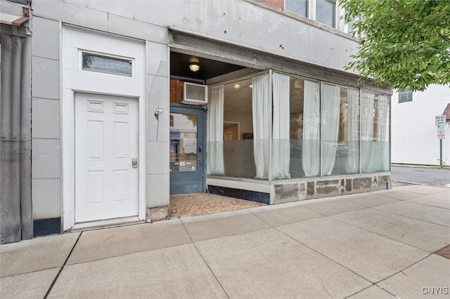 79-81 Main St, Sidney, NY 13838 - doorway to property featuring a wall mounted air conditioner