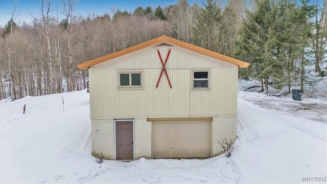 view of snow covered garage