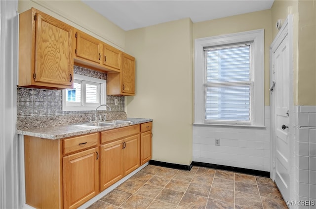 kitchen with light countertops and a sink