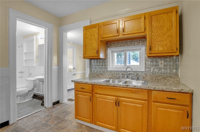 kitchen featuring a sink and decorative backsplash