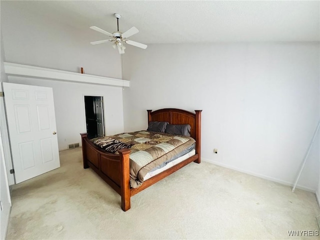 bedroom featuring lofted ceiling, ceiling fan, baseboards, and light colored carpet