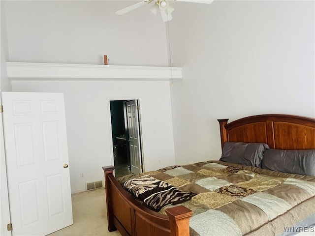 bedroom with ceiling fan, visible vents, and light colored carpet