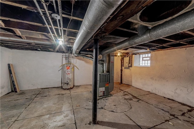 basement with electric panel, heating unit, and water heater