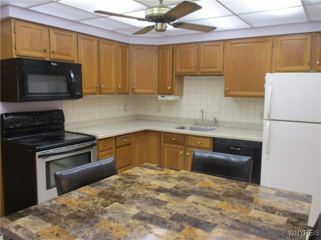 31 Park Lane Ct, Amherst, NY 14221 - kitchen with ceiling fan, a sink, backsplash, black appliances, and brown cabinetry