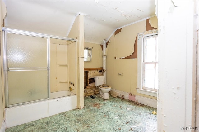 full bathroom with enclosed tub / shower combo, toilet, and tile patterned floors