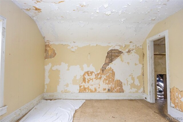 1511 13th St, Niagara Falls, NY 14305 - unfurnished bedroom featuring lofted ceiling