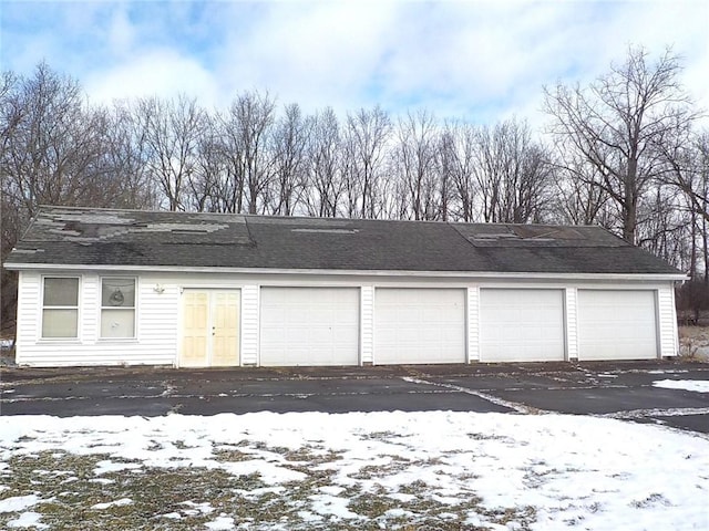 view of snow covered garage